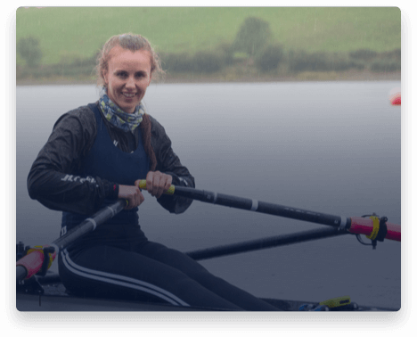 iFit Trainer Aifric Keogh rowing on the water in Ireland.