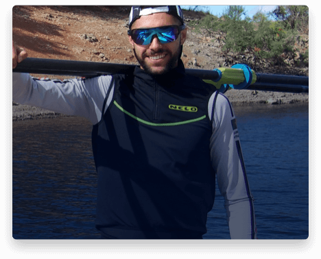 iFit Trainer Afonso Duarte Costa standing with his rowing oars.