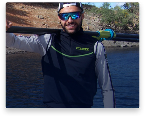 iFit Trainer Afonso Duarte Costa standing with his rowing oars.
