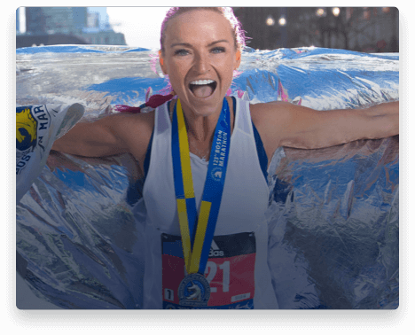 iFit Trainer Ashley Paulson leading a workout in Boston at the Boston Marathon.