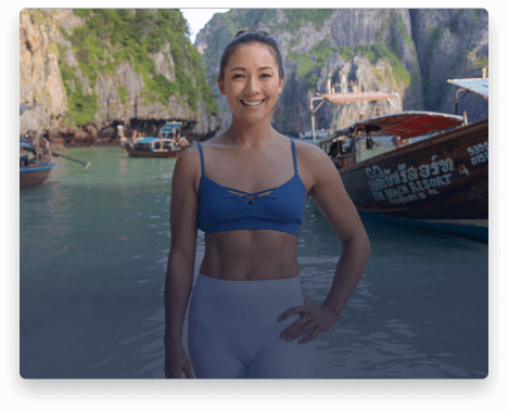 iFit Trainer Briohny Smyth standing on a beach in Thailand.