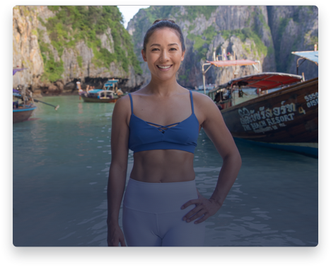 iFit Trainer Briohny Smyth standing on a beach in Thailand.