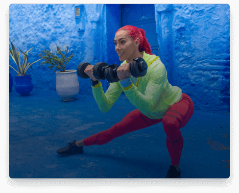 iFit Trainer Hannah Eden leading a dumbbell workout.