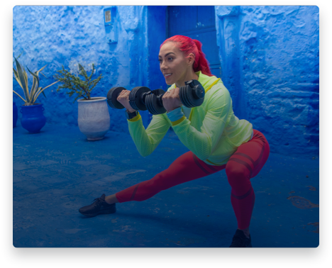 iFit Trainer Hannah Eden leading a dumbbell workout.