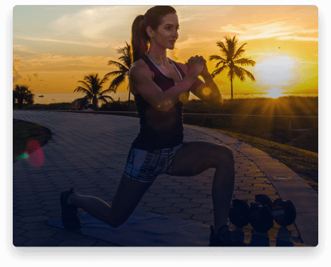 iFit Trainer Idalis Velazquez doing lunges during a workout in Florida.