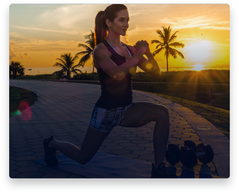 iFit Trainer Idalis Velazquez doing lunges during a workout in Florida.